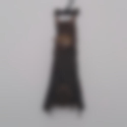 A blurred taxidermied image of an upside down Javan pipistrelle.