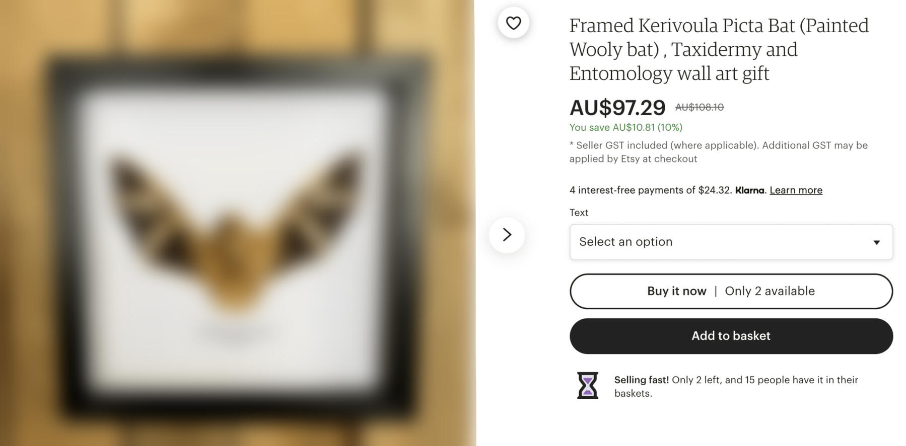 A blurred image of a painted wooly bat mounted and framed against a wooden background. To its right is an Etsy title and description for the listing.
